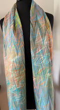 Load image into Gallery viewer, Double marbled  blue orange pink  Charmeuse  Silk 72x14” bold fun. This beautiful silk makes a unique dresser cover and scarf