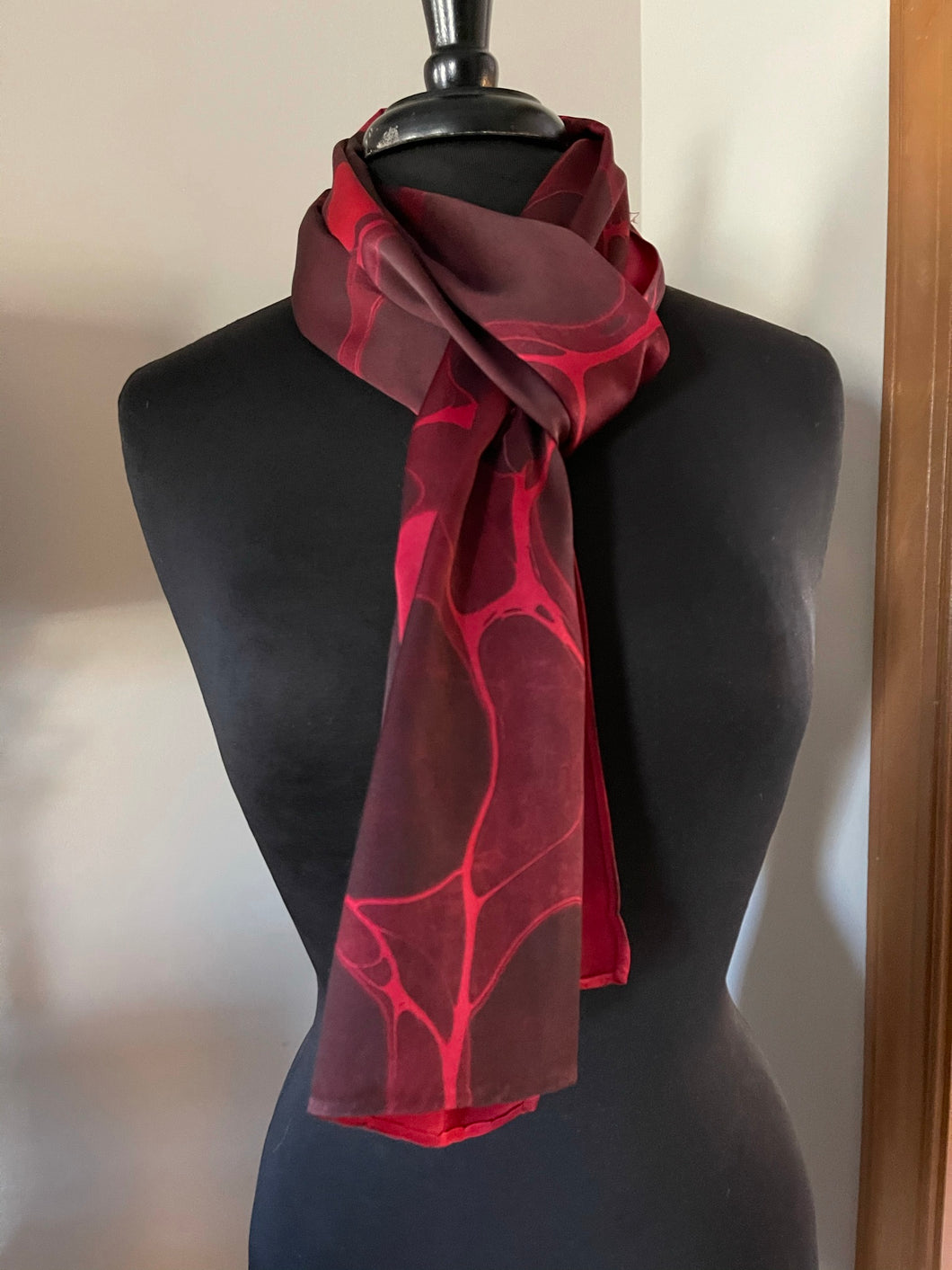 Red stone  marbled Charmeuse  Silk 72x14” bold fun. This beautiful silk makes a unique dresser cover and scarf
